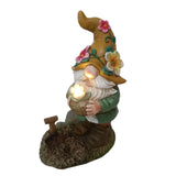 Nain de jardin à fleur lumineuse sur fond blanc