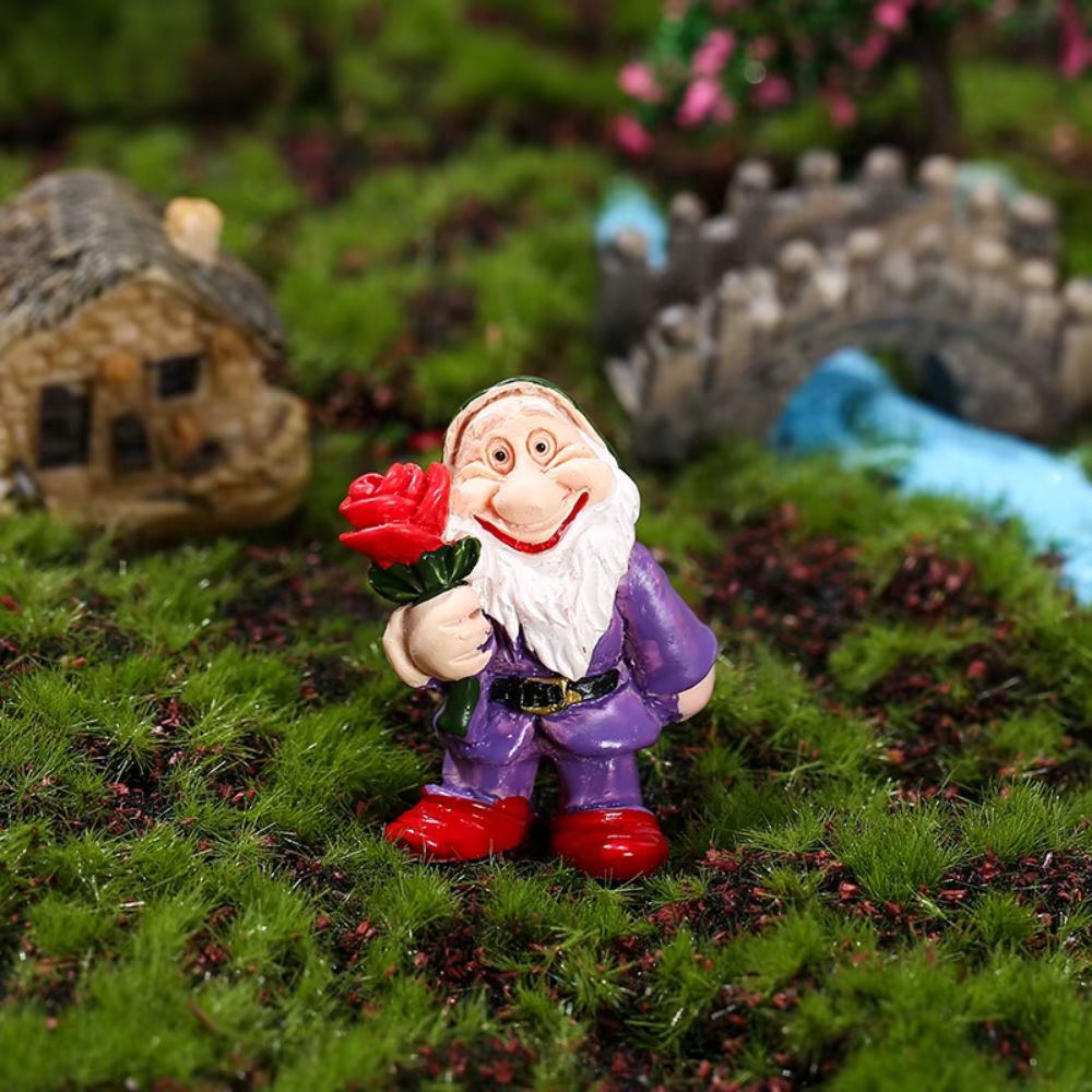 nain de jardin blanche neige avec fleur