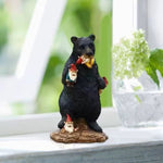 nain de jardin avec un ours