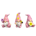 Lot de 3 nains de jardin de couleur rose sur fond blanc