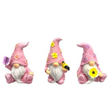 Lot de 3 nains de jardin de couleur rose sur fond blanc