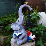 Nain de jardin éléphant avec nain assis
